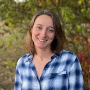 casie in front of trees