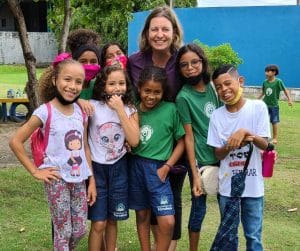 Ruth and kids in front of kitchen at cbc