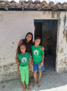 Family outside their home.