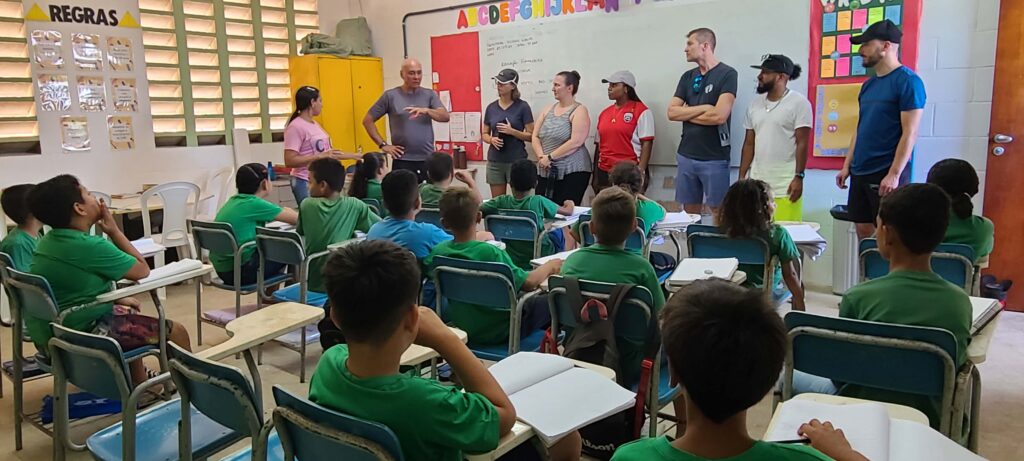 Group of people visiting a classroom.