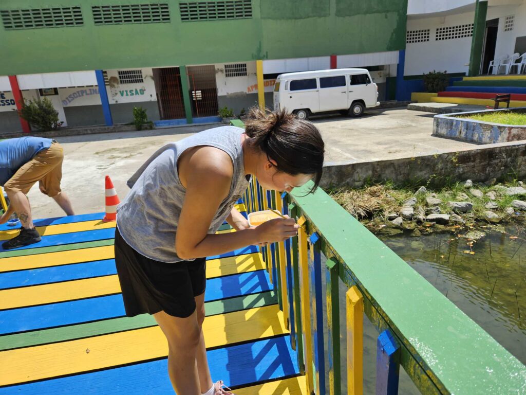 girl painting bridge at CBC.