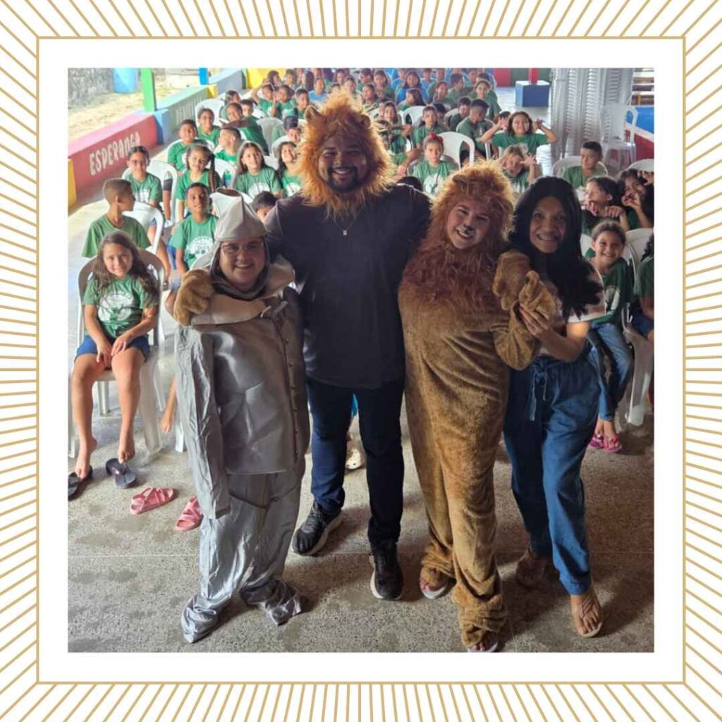 teachers dressed as lions standing in front of a group of cbc students in chapel