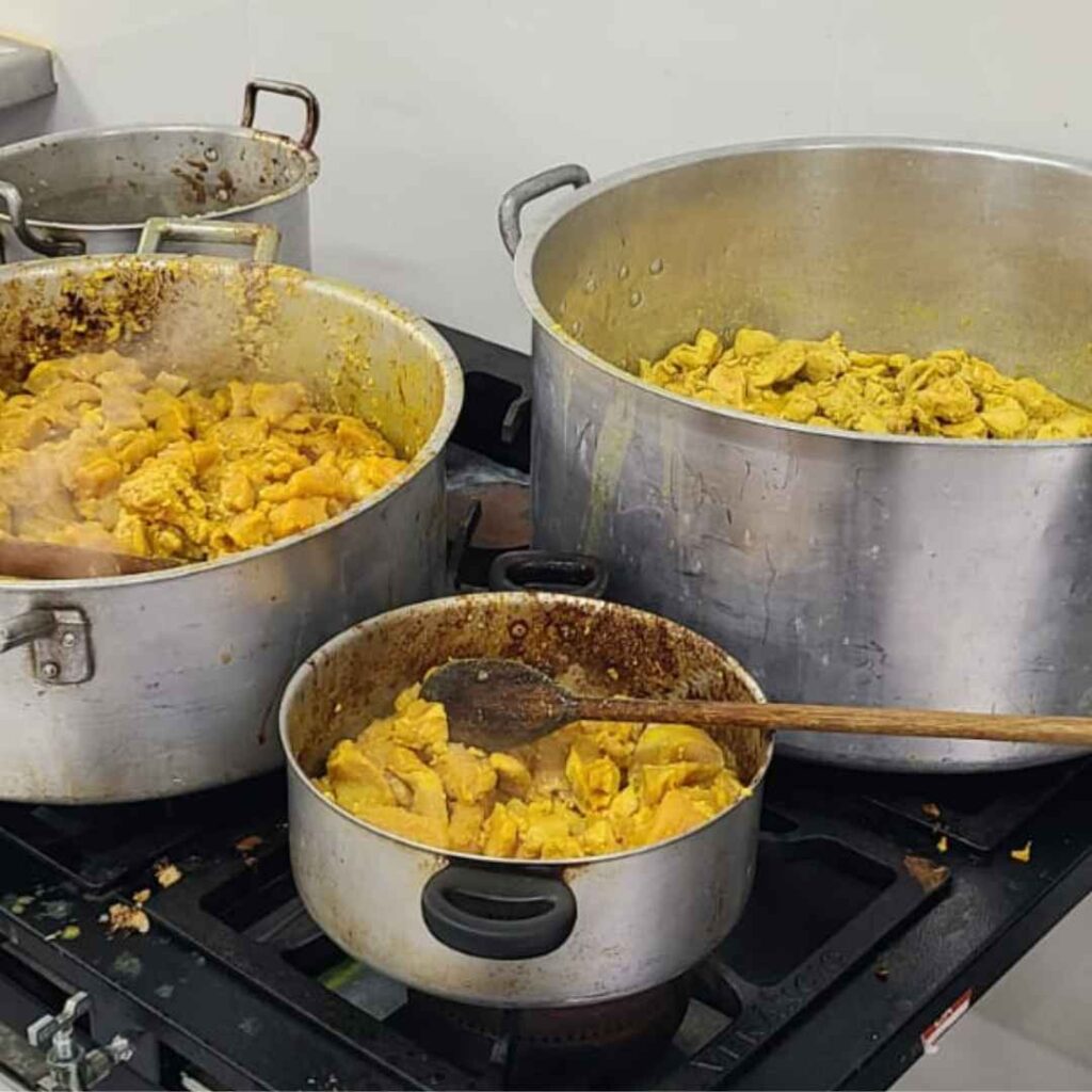Three pots of steaming chicken